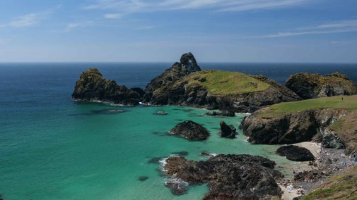 The view over rocks and a small beach at Kynance Cove, Cornwall.